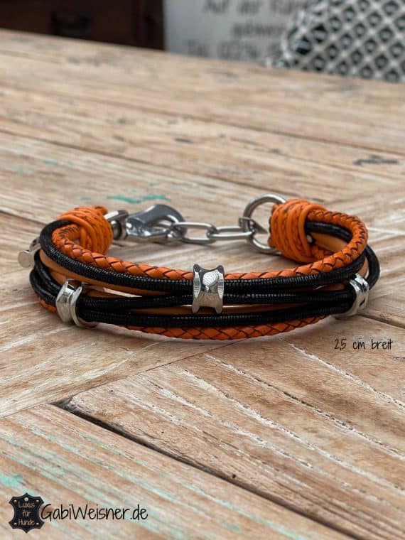 Luxus Hundehalsband für kleine Hunde. Edle Nappaleder im Mix ca. 2,5 breit. Dekoriert mit 3 Ohr-Tunnel aus Chirurgenstahl. Edle Leder in Orange und Schwarz.